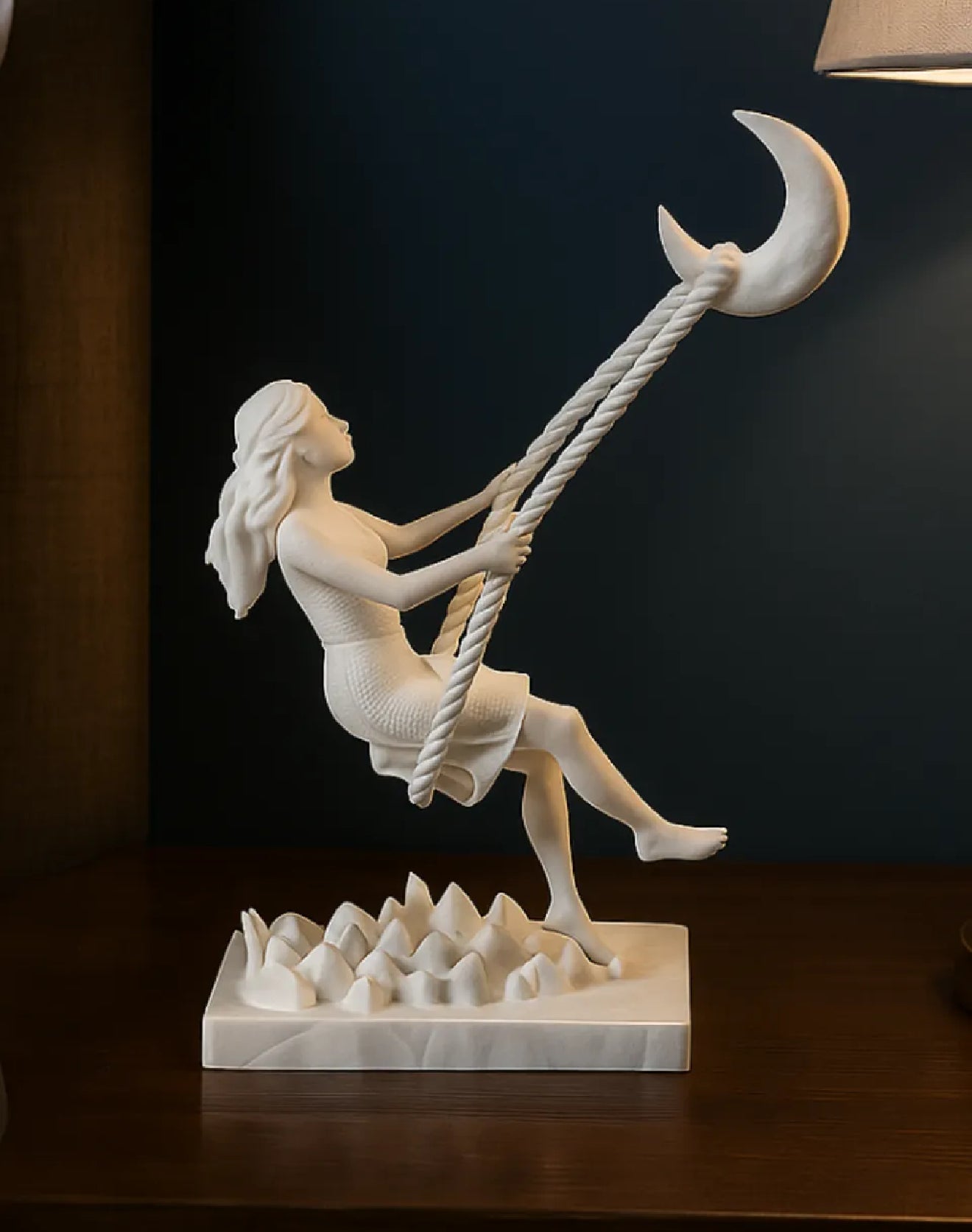 swinging to the moon statue