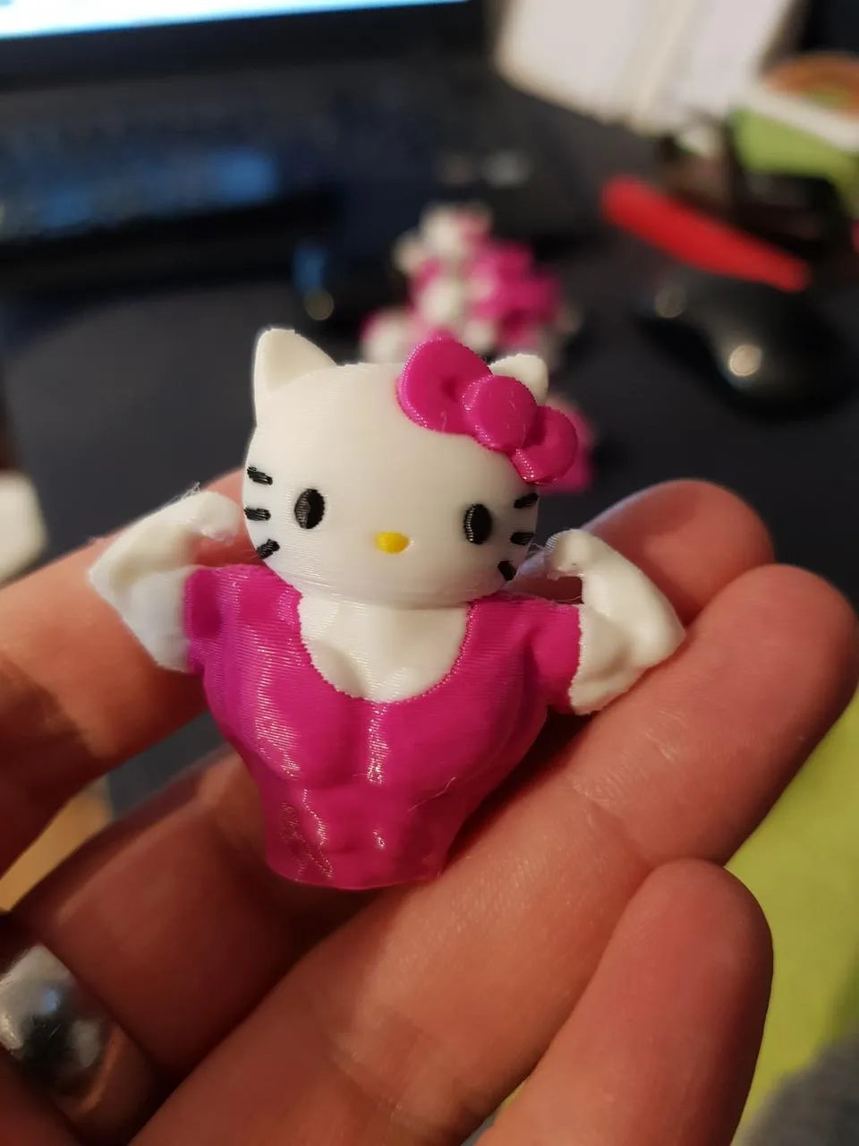 Hello kitty muscular keychain