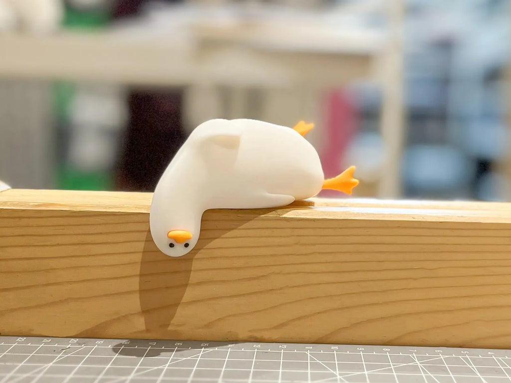 Lying lazy duck monitor/desk friend